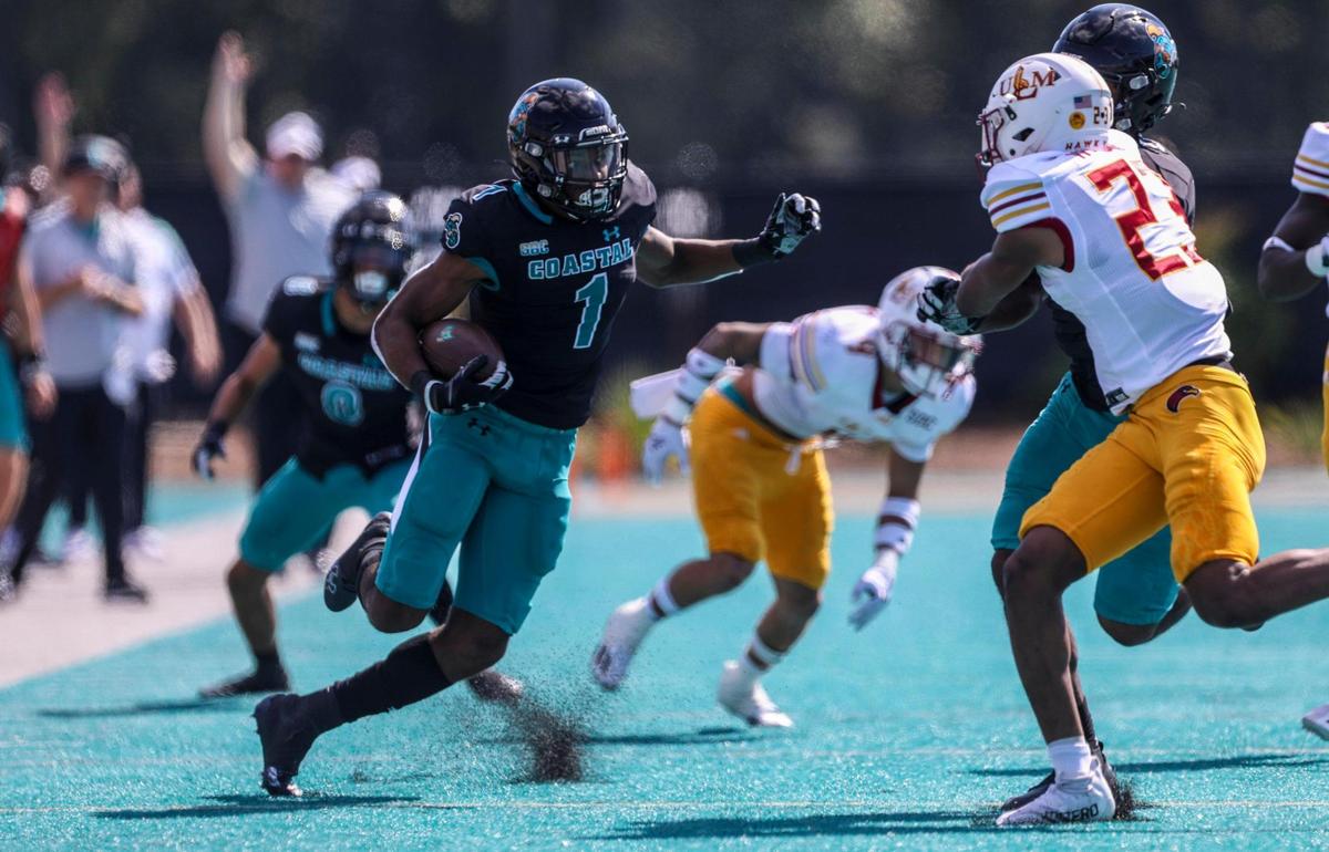 Coastal Carolina’s Braydon Bennett runs for big yardage vs Louisiana-Monroe on Saturday. The No. 16 CCU Chanticleers football team defeated ULM Saturday at Brooks Stadium in Conway, SC. Oct. 2, 2021.