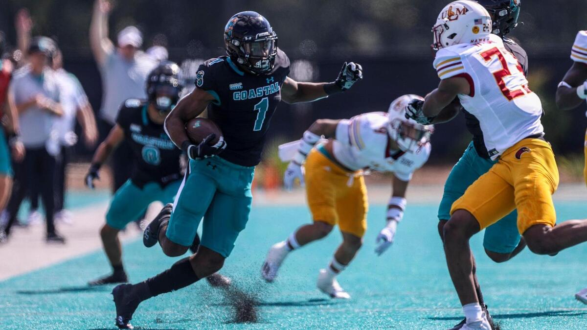Coastal Carolina’s Braydon Bennett runs for big yardage vs Louisiana-Monroe on Saturday. The No. 16 CCU Chanticleers football team defeated ULM Saturday at Brooks Stadium in Conway, SC. Oct. 2, 2021.
