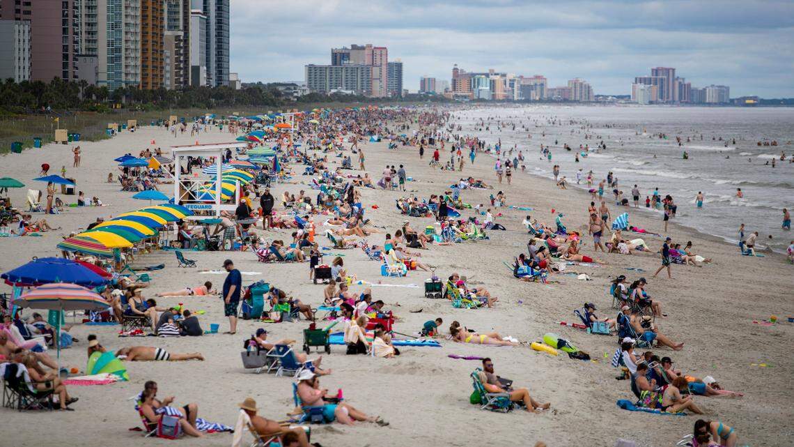 A northbound view of the beach as crowds gather along the coast in Myrtle Beach.