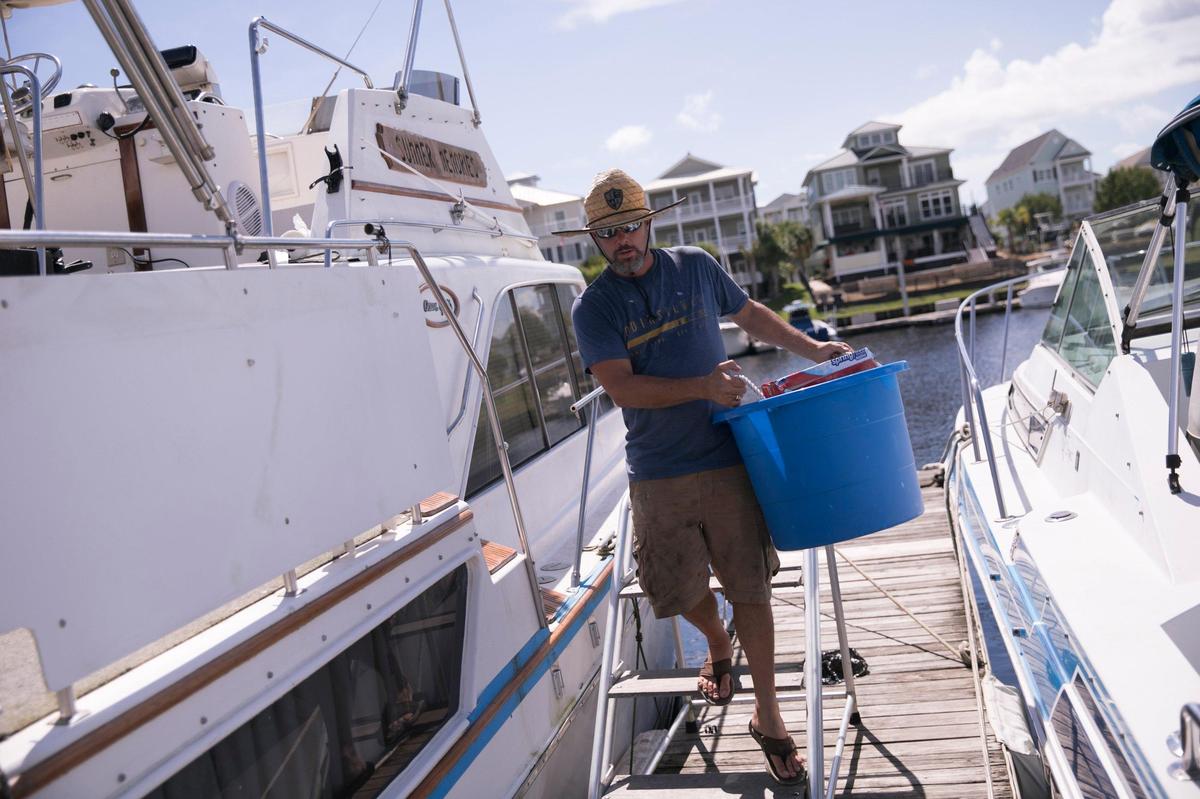 Dylan Goodwin was still debating whether to stay on his boat “Summer Memories” at the Doc Holiday Marina on Wednesday afternoon prior to Hurricane Florence’s arrival on Wednesday, September 10, 2018.