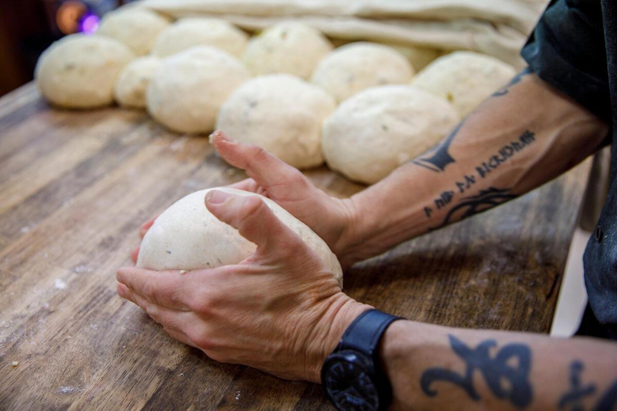 James Levy prepares sour dough for baking at Leve’ Bakery. Leve’ Bakery prepares sour dough bread for their retail shop and farmers market. They prepare 50 to 60 loaves a day. Oct. 23, 2024.