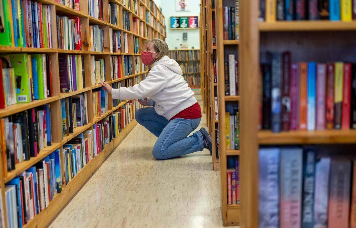 Customer Debbie Lyons searches through the stacks of used books at The Bookworm. Courtney Hornyak, owner of The Bookworm, a used book store in Murrells Inlet says that her business as thriving as more people stay home and read during the coronavirus pandemic. February 3, 2021.