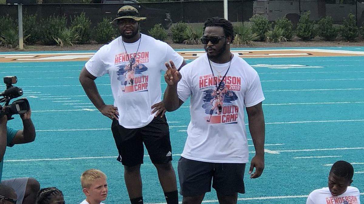 De’Angelo Henderson addresses campers during his first free youth football camp at Coastal Carolina’s Brooks Stadium last summer.