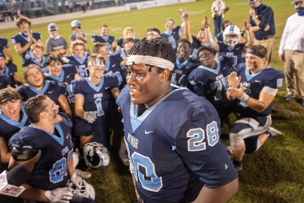 Aynor’s Ahmad Gerald speaks to the media as he celebrates with his teammates after a win against Loris. The Blue Jackets hosted the Lions in their 2020 homecoming football game. October 23, 2020.