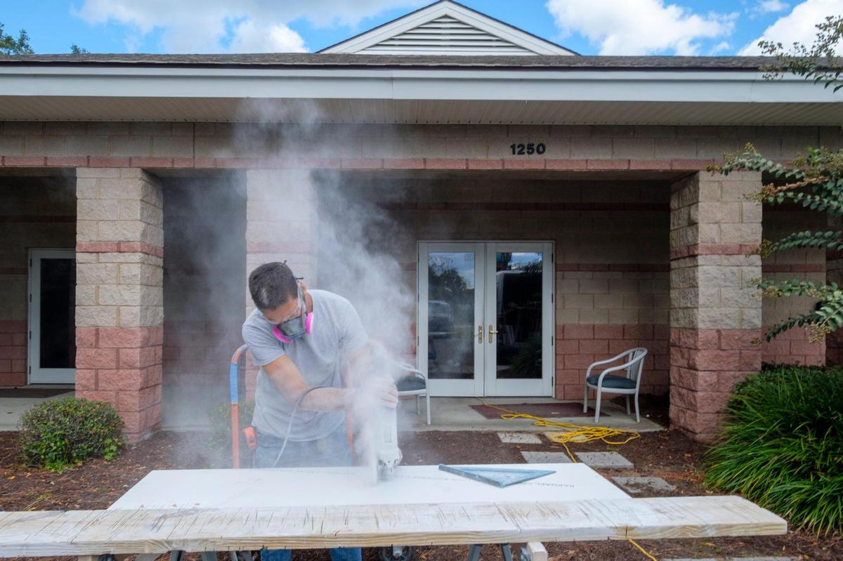 An installer cuts new granite countertops for Myrtle Beach Fire Station 1. Oct. 29, 2021. The owners of Milano Kitchen & Baths are building and donating new kitchens valued at $40,000 each to Myrtle Beach Fire Department stations numbers 1 and 5 after a grand opening raffle held by the new business.