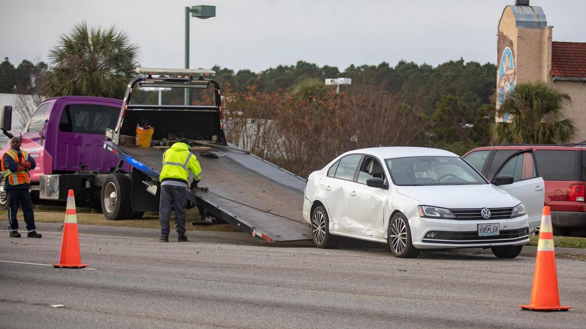 Crews work to remove a car from the scene of a crash on U.S. Highway 17 Bypass on Dec. 12.