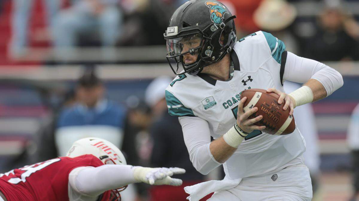 Coastal Carolina senior quarterback Kilton Anderson looks to avoid pressure from South Alabama on Friday.