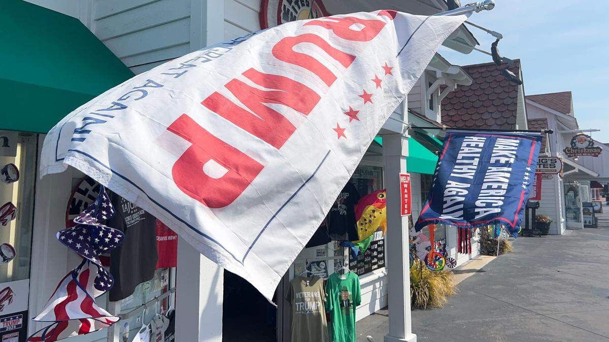 Flags fly on the storefront display of Klig’s Kites at Broadway at the Beach. TSN File.
