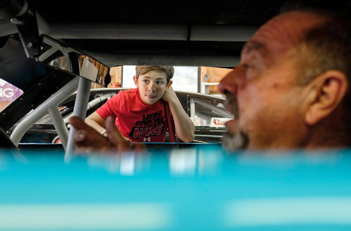 Samie Scarpelli Jr. gets some help from his grandson Chase Scarpelli, age 12, in setting up his car for his last race at Myrtle Beach Speedway. As the Myrtle Beach Speedway prepares to hold it’s last race, local drivers are readying their cars and reminiscing about their days at the track. August 12, 2020.