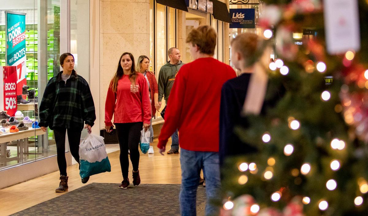 Holiday shoppers rush to take advantage of deals on Black Friday at Coastal Grand Mall in Myrtle Beach after the Thanksgiving holiday.