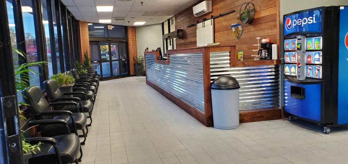 The front desk and waiting room the family-owned Rob’s Auto Body, which recently moved to a former supermarket location at 901 Church Street in Conway.