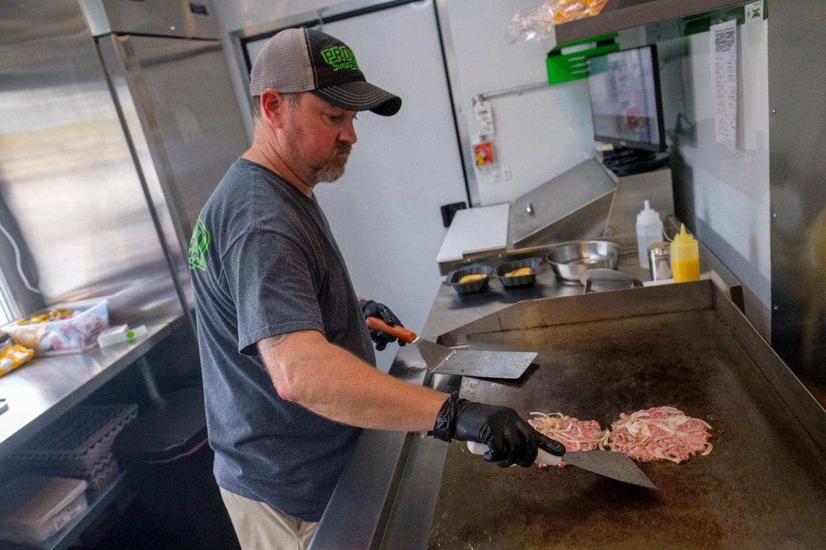 Mike Hensley’s Project Smashburger, a food truck that serves smashburgers and loaded fries, is now also in Palmetto Taps in Conway.