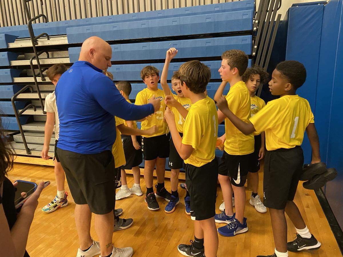 Brian Weaver, pictured here in the blue shirt, was active in the Little River and North Myrtle Beach communities as a coach and mentor. He died of COVID-19 August 9, 2021.