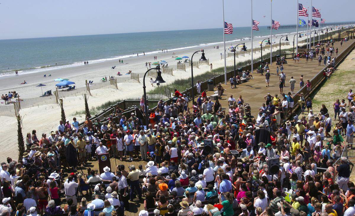 Myrtle Beach Mayor John Rhodes address the crowd at the Myrtle Beach Boardwalk celebration at the end of 9th Street North. Photo by Tom Murray tmurray@thesunnews.com