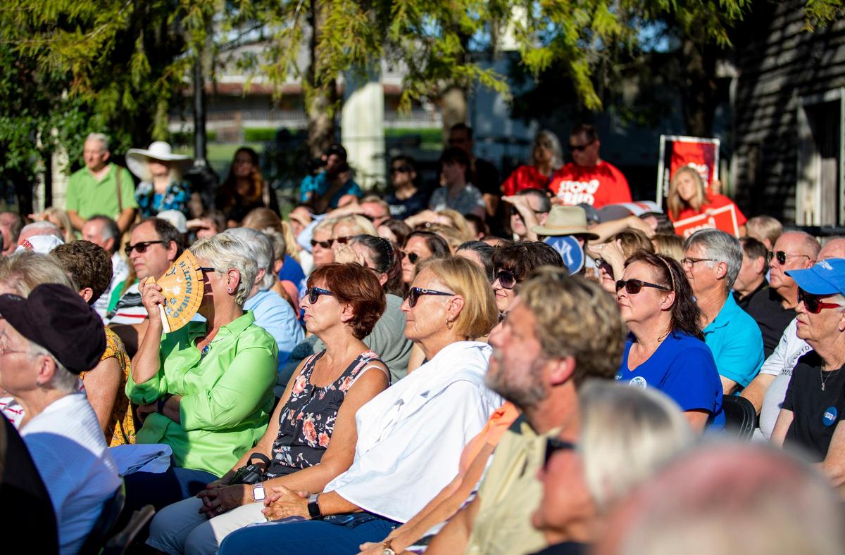 Conway residents sit and listen as South Bend, Indiana Mayor and 2020 Democratic Presidential Candidate Pete Buttigieg speaks Tuesday morning along the Conway Riverwalk in Conway, S.C.