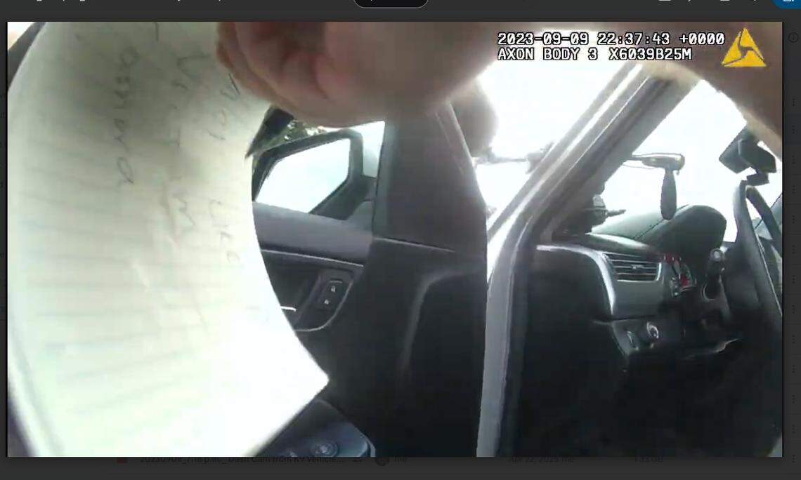 This is a screenshot of the bodycam provided by Scott Spivey’s family that allegedly shows where Patrol Division Sergeant Paul Damon Vescovi wrote on a notepad “ACT LIKE VICTIM CAMERA.”