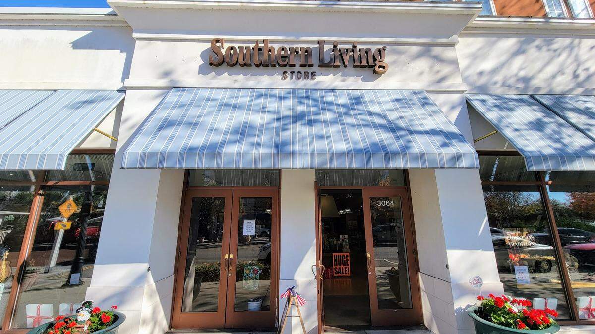 Signs read “store closing” and “huge sale” in The Southern Living Store in The Market Common.