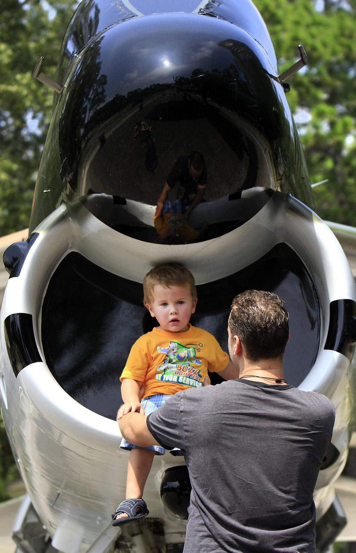 Elisabeth and Michael Chapman and son Ethan, 2, of North Myrtle Beach, spent part of their family day together at War Bird Park in Myrtle Beach on Monday. The park will be the site of a a candlelight vigil and memorial for prisoners of war and those still listed as missing in action hosted by the local Rolling Thunder chapter will hold at 7 p.m. Sept. 16. Photo by Steve Jessmore sjessmore@thesunnews.com