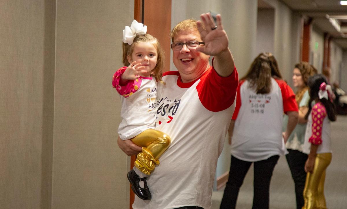 Darin Green stands with his newly-adopted daughter Katie Grace Major-Green.