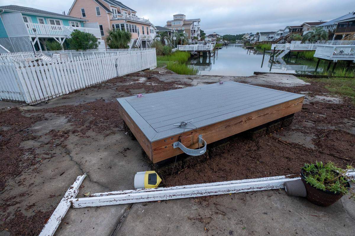 Flooding and storm surge from Hurricane Isaias damaged docks in the Cherry Grove area canals and left a debris field on the beach in North Myrtle Beach after a section of pier collapsed and sand dune walkways were destroyed. August 4, 2020.