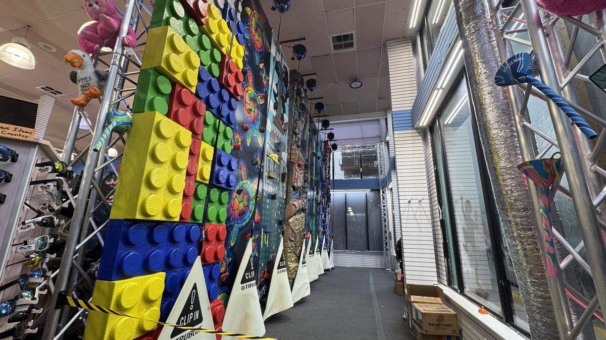 A Pacific Beachwear store in North Myrtle Beach houses a colorful climbing wall near its front windows. A woman fell from the wall after staff allegedly did not ensure her safety harness was correctly attached, witnesses said.