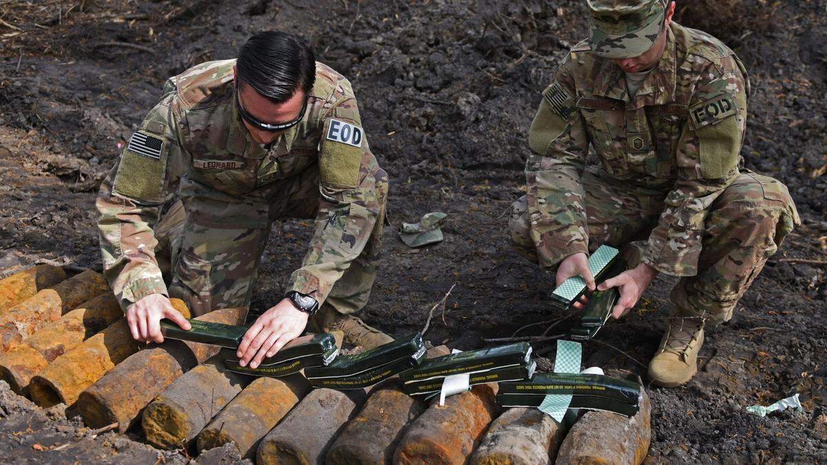 Shaw EOD personnel prepare ordnance for controlled detonation in an empty lot along Carolina Forest Boulevard in April 2018. Another bomb is being set off in the area in April 2024.