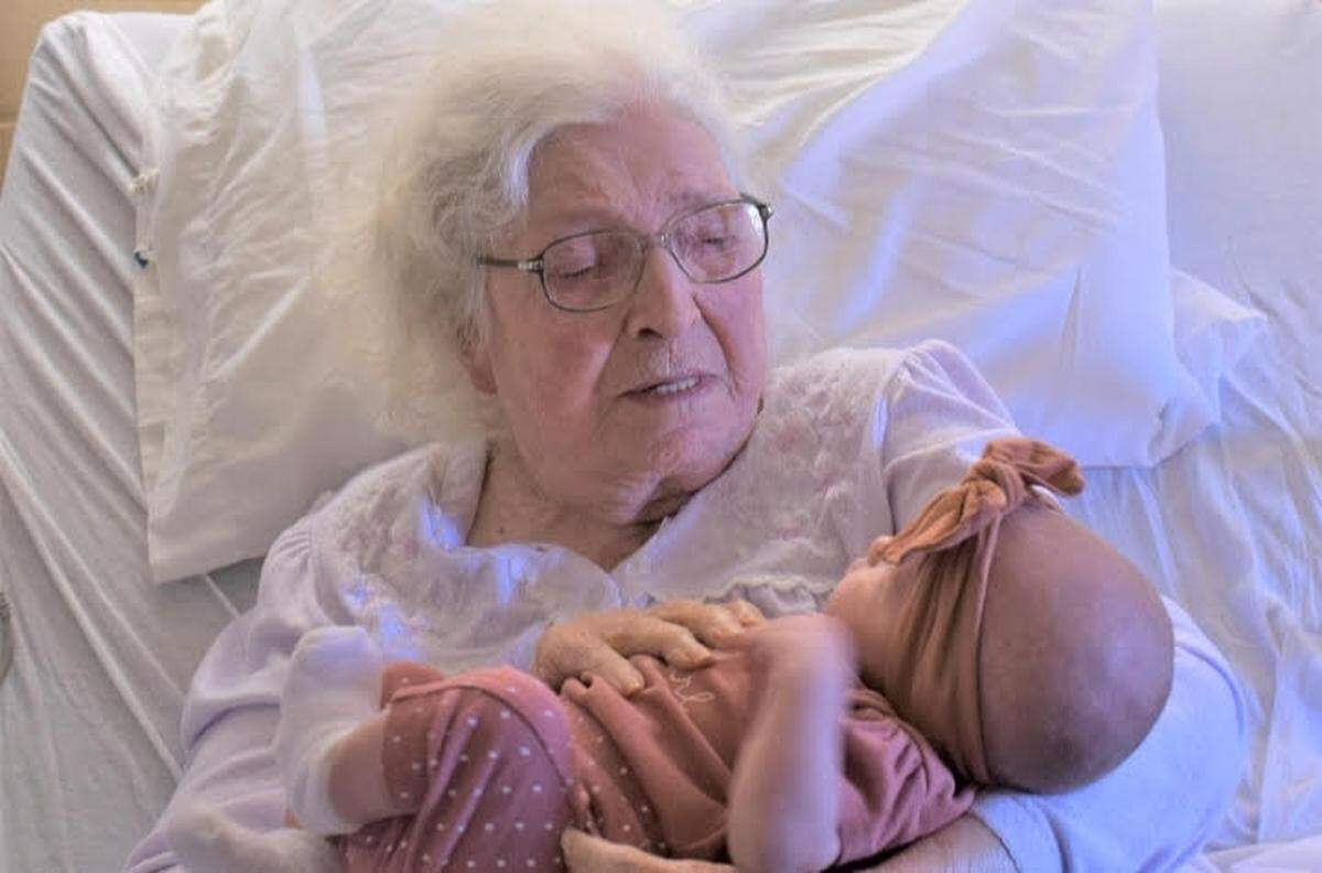 MaeDell, holding her great-great-great granddaughter, Zhavia