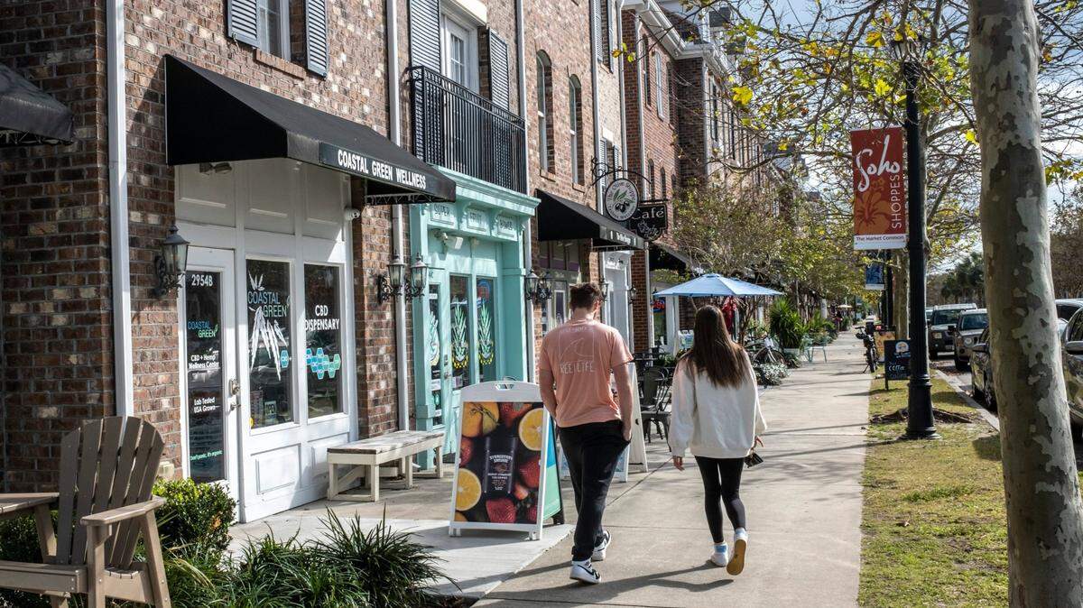 Shoppers stroll through the Market Common in Myrtle Beach. Parking in the area has been limited since the garage on Deville Street closed for construction in October.