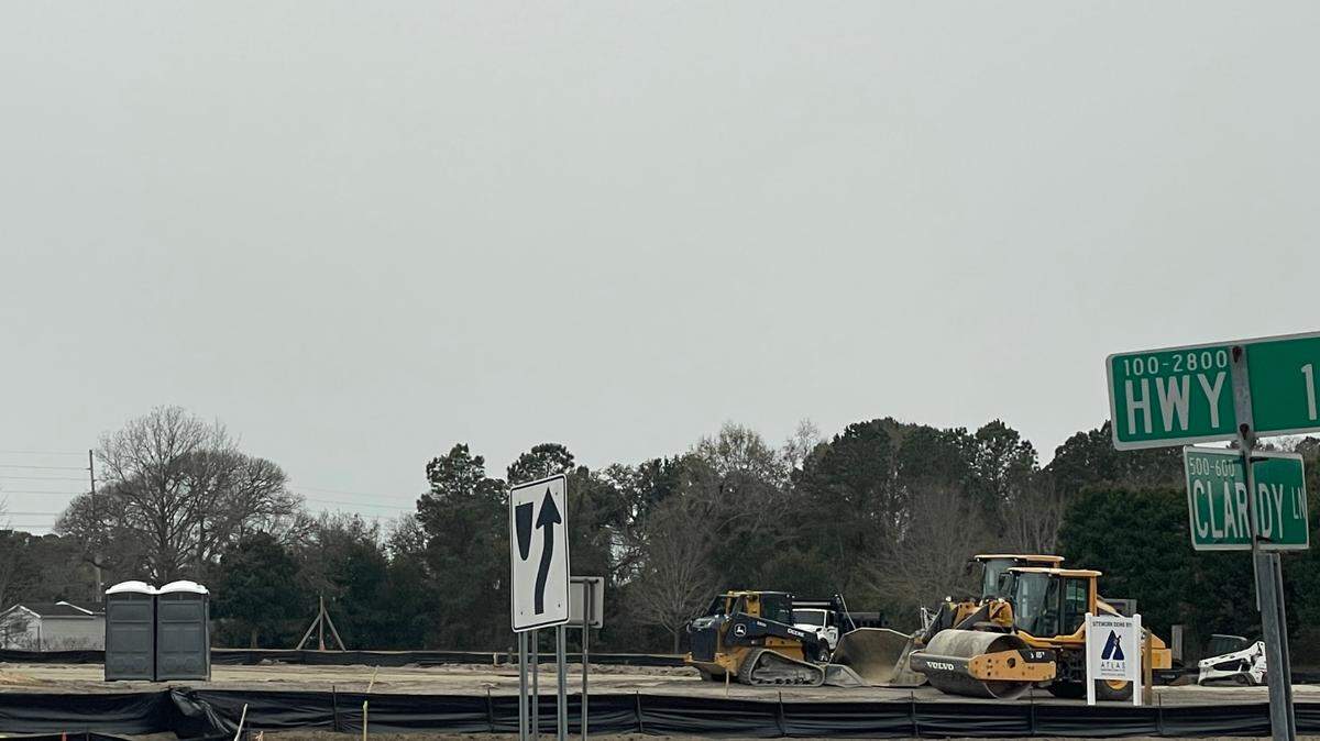 Construction machinery works on land along U.S. 17 in Little River. Horry County Land Records show the plot received permits to open a gas station there.