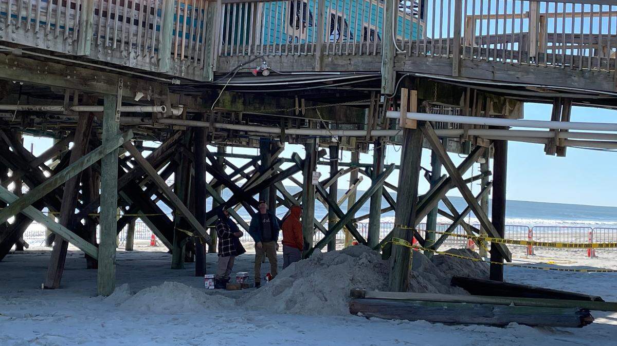 Construction crews work Tuesday to shore up Pier 14 in Myrtle Beach after a Myrtle Beach police officer crashed a patrol vehicle into the pier Dec. 16. Dec. 19, 2023