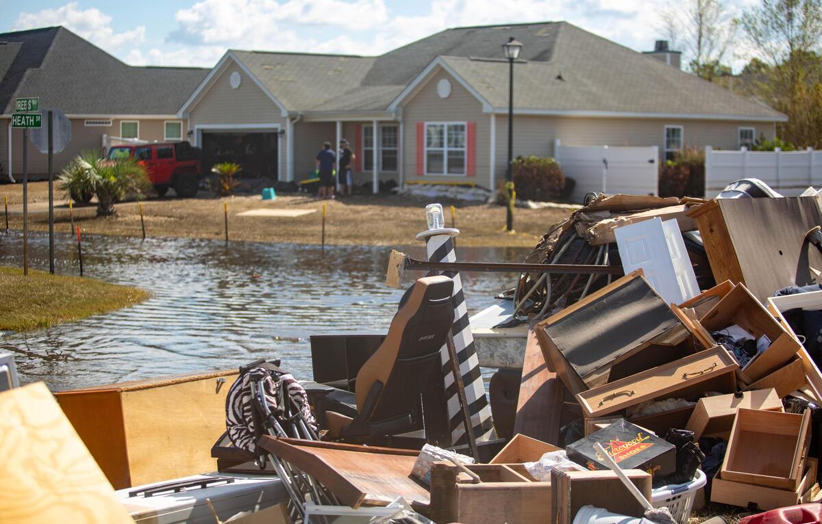 Front yards can be seen littered with carpet, Sheetrock and mattresses Monday as Polo Hills residents begin the arduous task of restoring their homes after the storm.