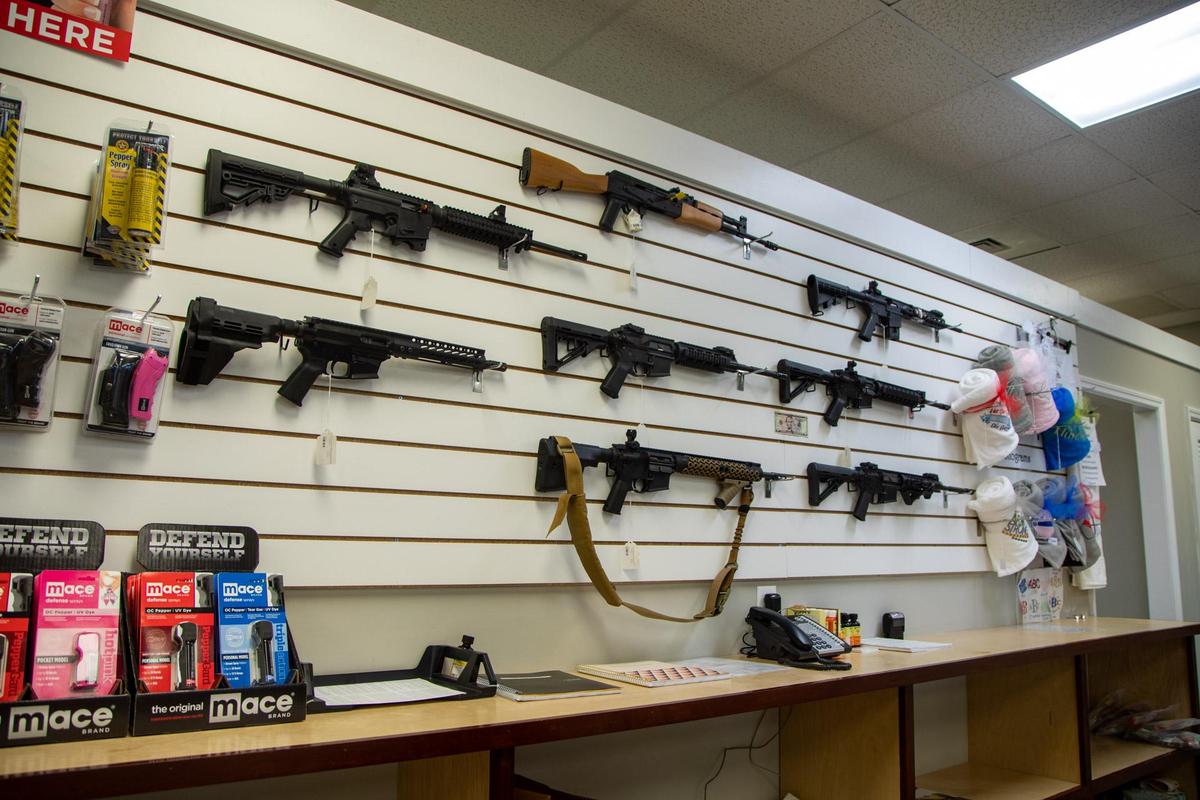Assault rifles line the walls of Cormac Arms & Outfitters on 38th Avenue in Myrtle Beach.