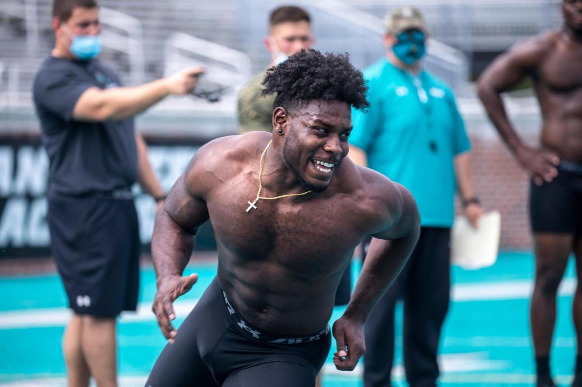 Coastal Carolina running back C.J. Marable runs a cone drill in front of pro football scouts at Coastal Carolina’s Pro Day held on Tuesday at Brooks Stadium in Conway, S.C. March 23, 2021.