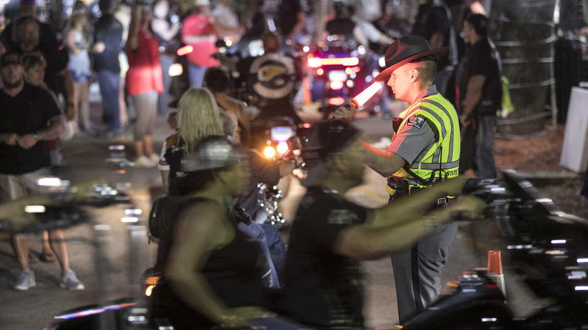 A South Carolina Highway Patrolman works to direct traffic on the main road into Murrells Inlet on Friday night. Bikers by the thousands visit the bars in Murrells Inlet on Friday night of the Myrtle Beach Spring Bike Rally. May 17, 2019.