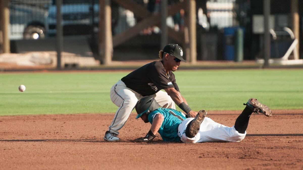 
Coastal Carolina’s Cory Wood, bottom, dives back to second base as LIU Brooklyn's Luis Arias misses the tag in the NCAA Conway Regional at Springs Brooks Stadium. Coastal and LIU Brooklyn were playing for the right to play the regional's No. 3 seed, Washington, in the winner's bracket at 5 p.m. Saturday. Washington defeated UConn 7-1 earlier Friday.
