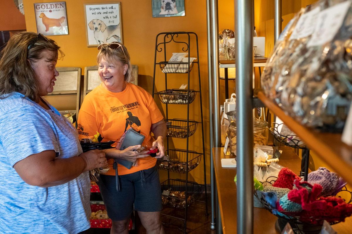 Alison Howe and Deidra Reynolds-Journey shop for pet treats at Kelly’s K-9 kitchen in The Market Common. Kelly Grindstaff turned her hobby of baking dog treats into a business and recently opened a second location at The Market Common specializing in pet treats made with only human ingredients. Thursday, July 24, 2019.