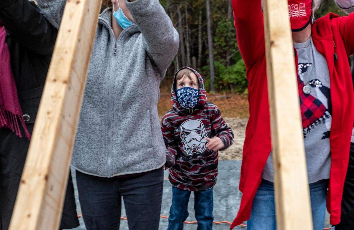 Kimberly Miller and her six-year-old son Tanner Ray attend a ground breaking of their new Habitat for Humanity home near Conway, S.C. December 16, 2020.