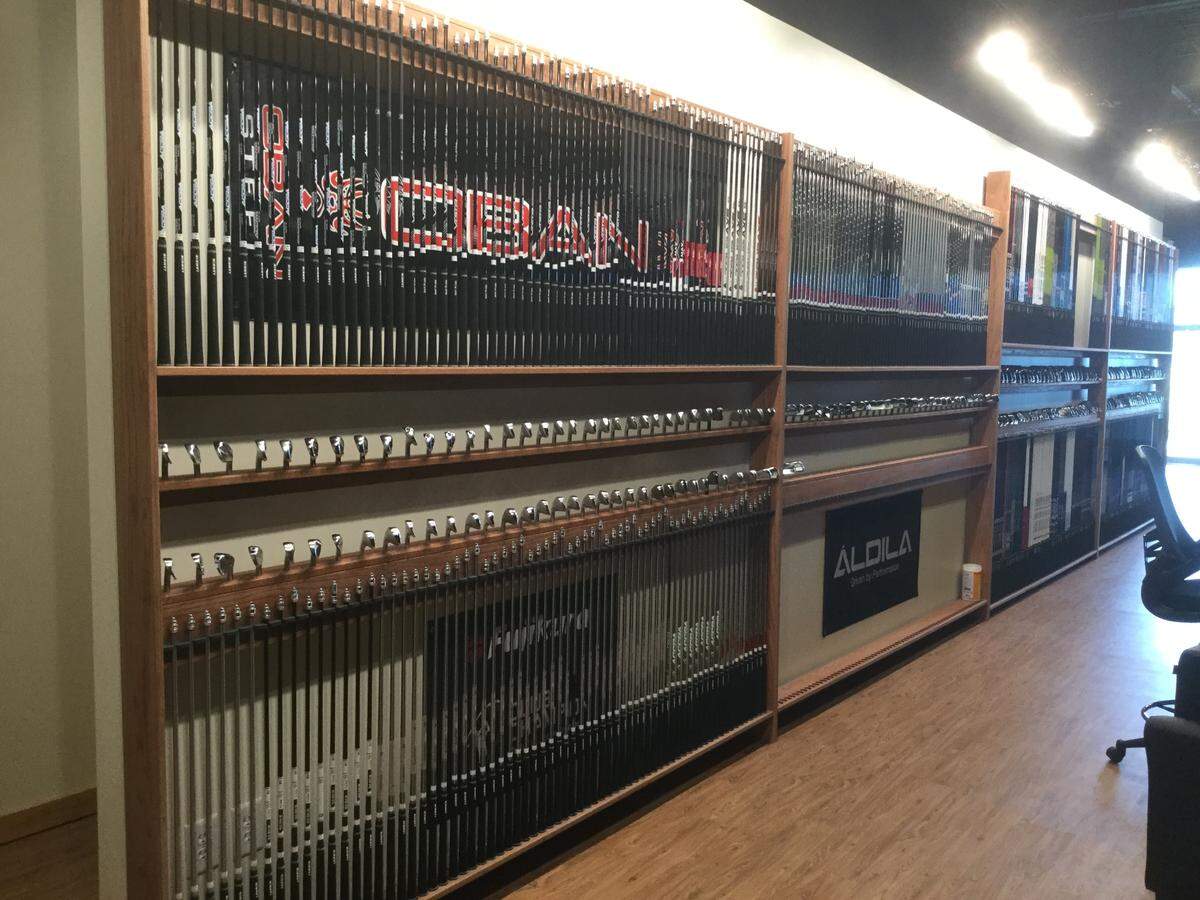 Club shafts and heads line a wall at the new Club Champion business in Myrtle Beach.