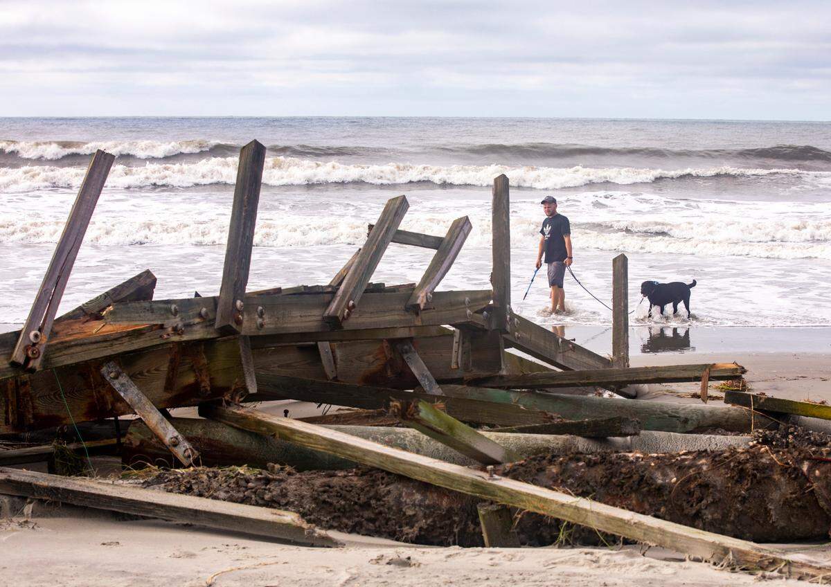 Flooding and storm surge from Hurricane Isaias damaged docks in the Cherry Grove area canals and left a debris field on the beach in North Myrtle Beach after a section of pier collapsed and sand dune walkways were destroyed. August 4, 2020.