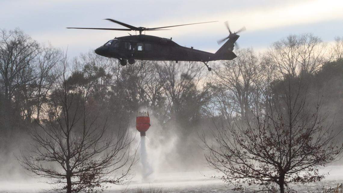Blackhawk helicopters from the South Carolina National Guard were deployed to drop water on the wildfires in the Carolina Forest area in the Myrtle Beach, S.C., area on Sunday. The drops will continue Monday.