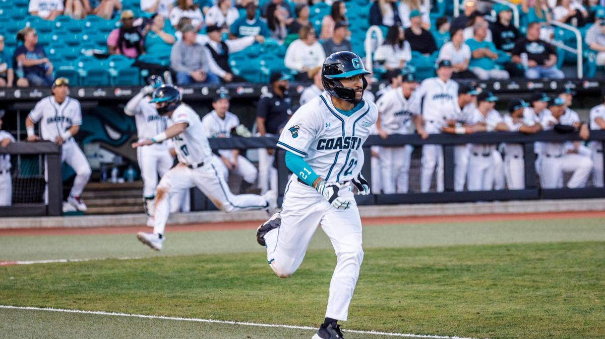 Coastal Carolina outfielder Austin White registers a hit that scores Matt McDermott during the third inning of CCU’s season opener against Kent State during the Baseball at the Beach Tournament at Spring Brooks Stadium in Conway on Friday afternoon. February 18, 2022.