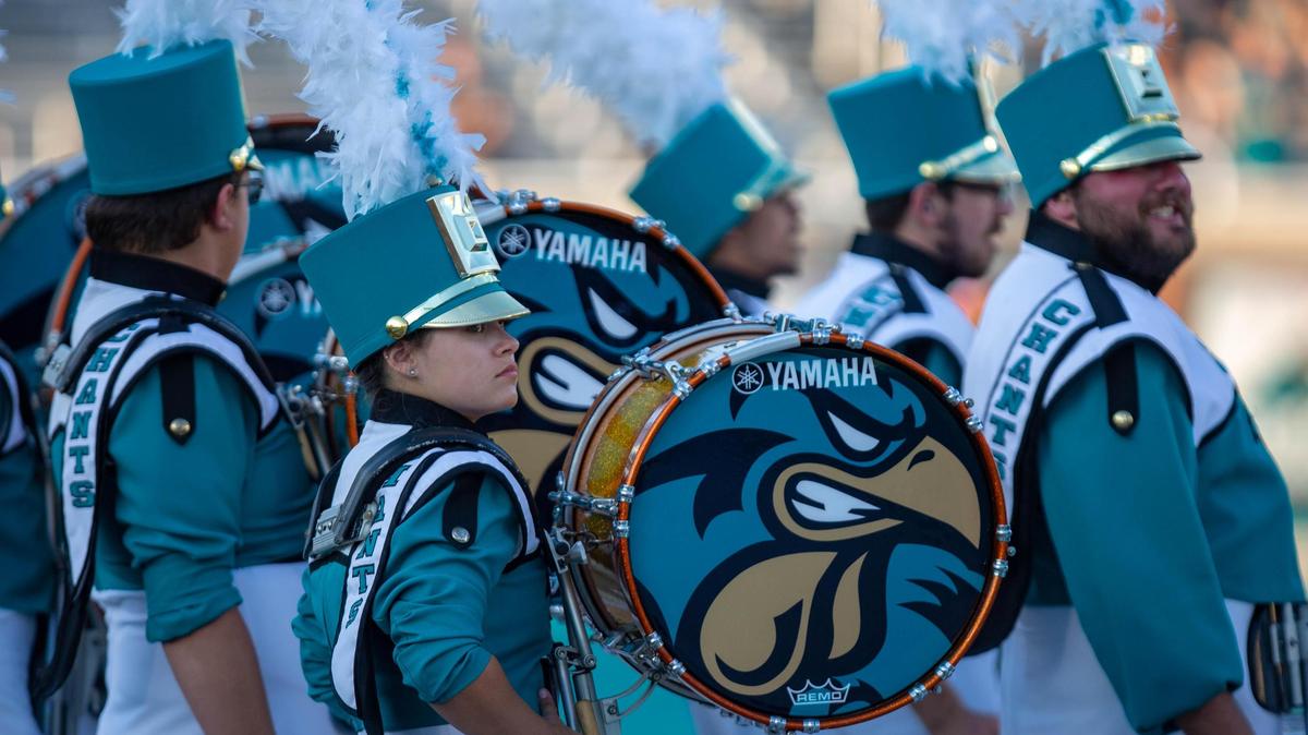 The Coastal Carolina marching band prepares to perform Saturday at Brooks Stadium in Conway before the Chanticleers’ matchup against the University of Louisiana-Monroe Warhawks.