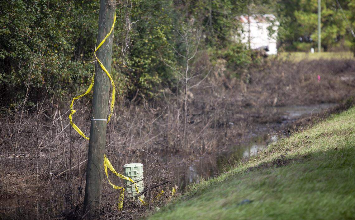 Crime scene tape can be seen along U.S. Highway 76  in Marion County Tuesday. Horry County Sheriff’s deputies were transporting Nicolette Green and Wendy Newton, of Shallotte, N.C., from Conway to medical facilities in Darlington and Lancaster when the transport van was swept into floodwaters along Highway 76.