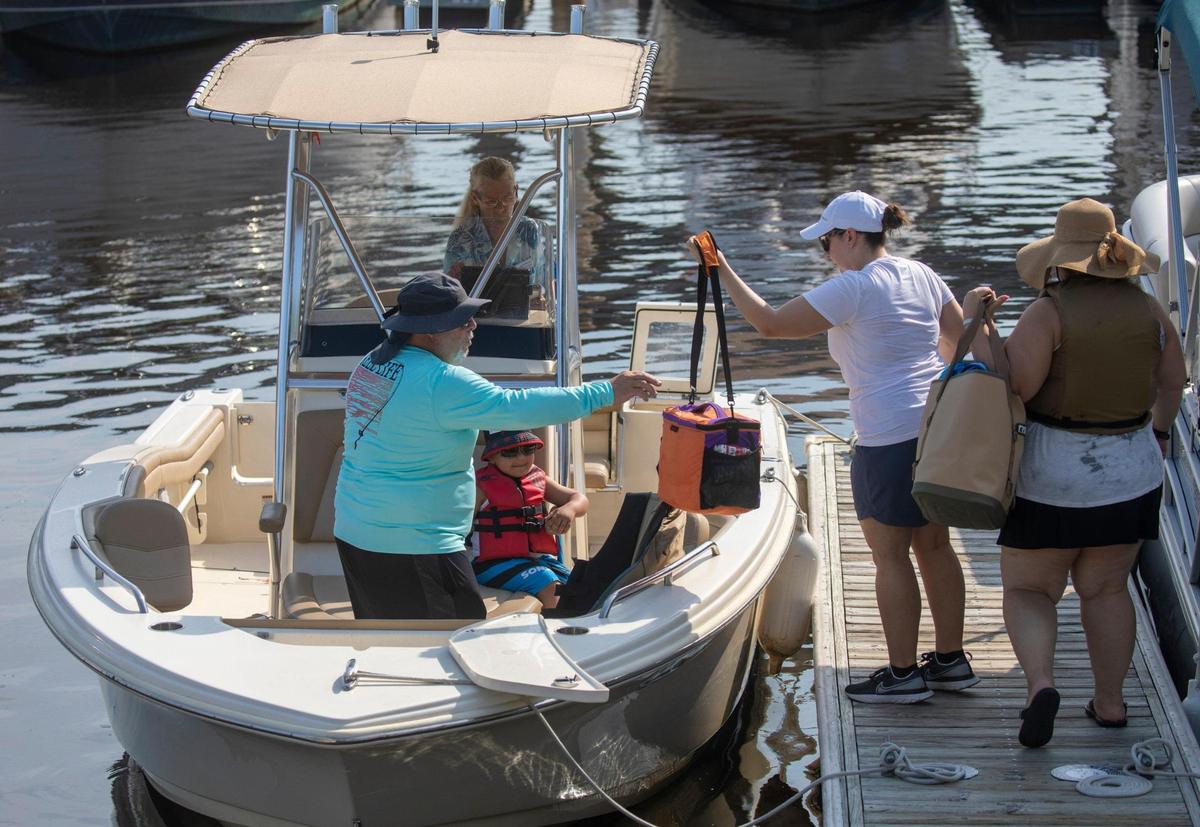 Members of Freedom Boat club load up at Harbourgate marina for a day on the water in North Myrtle Beach. The boat club, which maintains a fleet of vessels in three Myrtle Beach area locations, has experienced record membership growth due in part to low dealer inventories and post-pandemic interest in boating. Aug. 3, 2022.