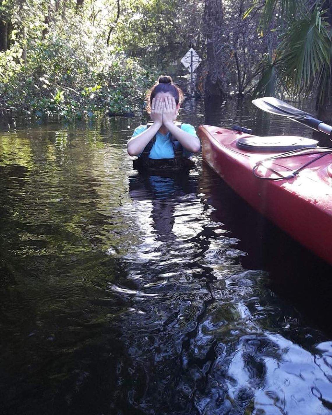 Chest-deep water surrounds Emy Chamberlain in the flood after Hurricane Matthew in 2016.