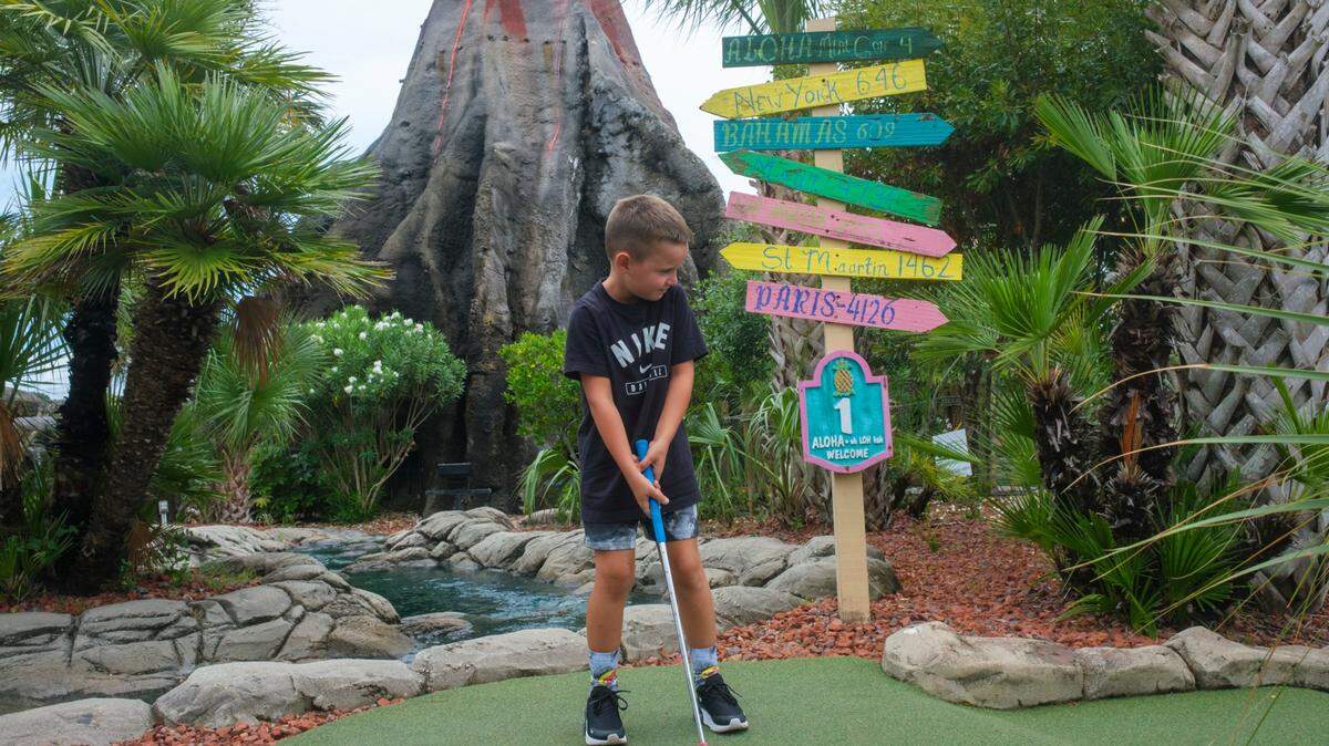 Visitors play miniature golf at Hawaiian Rumble Golf in North Myrtle Beach, S.C. The course, known as the “Home of the Masters” has hosted the U.S. ProMiniGolf Association Master’s tournament for 28 years. July 12, 2024.