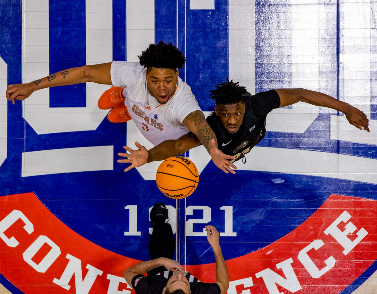 Mercer sophomore center Shannon Grant tips off against West Carolina junior forward Marlow Gilmore Friday night during the SoCOn Ingle Basketball Championships at the Harrah’s Cherokee Center in Asheville, N.C.