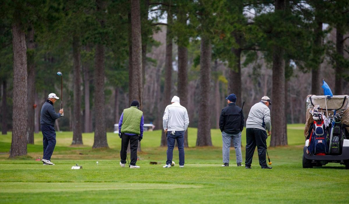 On a blustery January morning, golfers tee off at Man O’War Golf Club. Jan. 10, 2022.