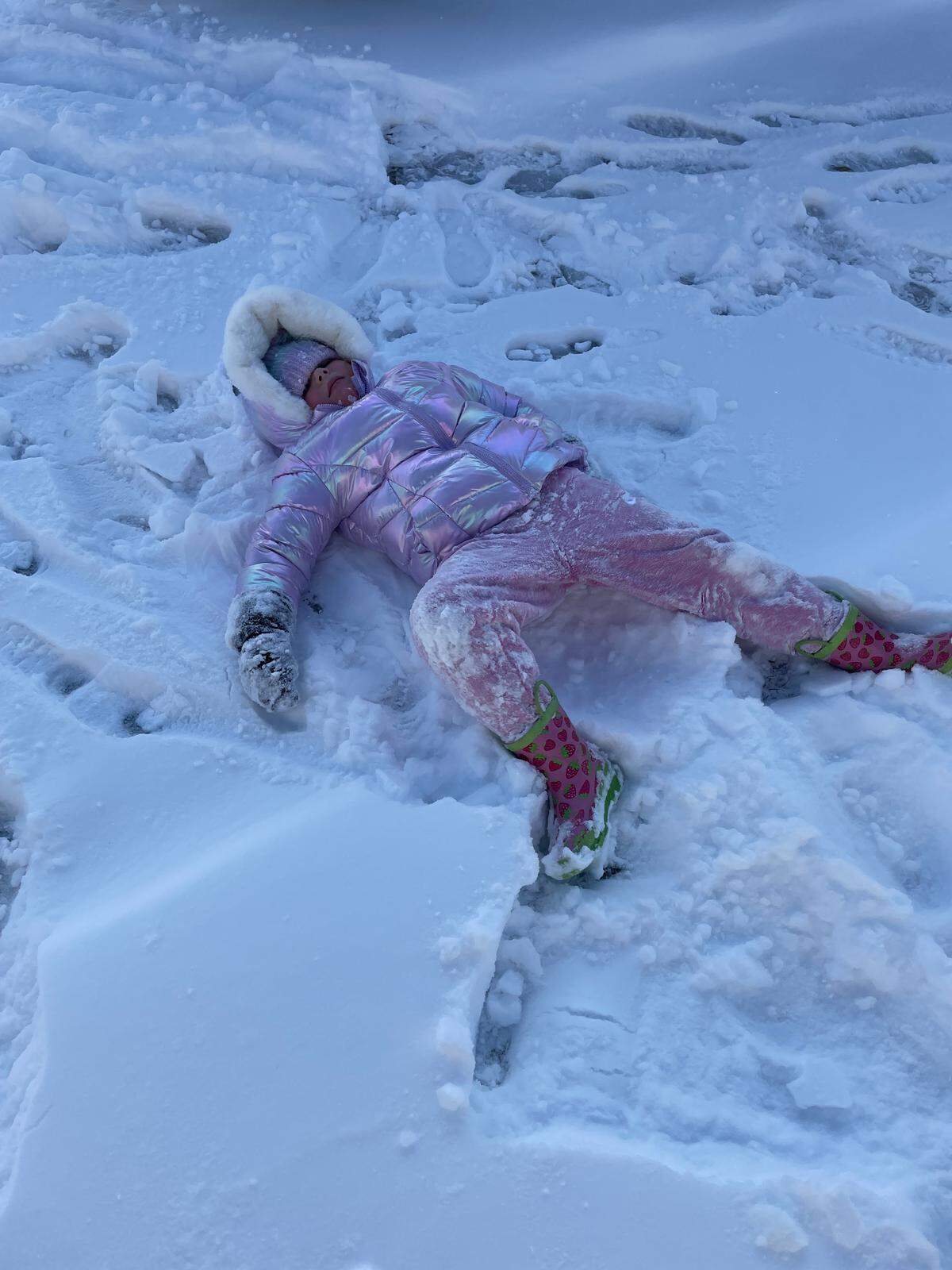 Four-year-old Blair Mullen makes snow angels in her yard in the Conway area on Sunday, Feb. 1, 2026.