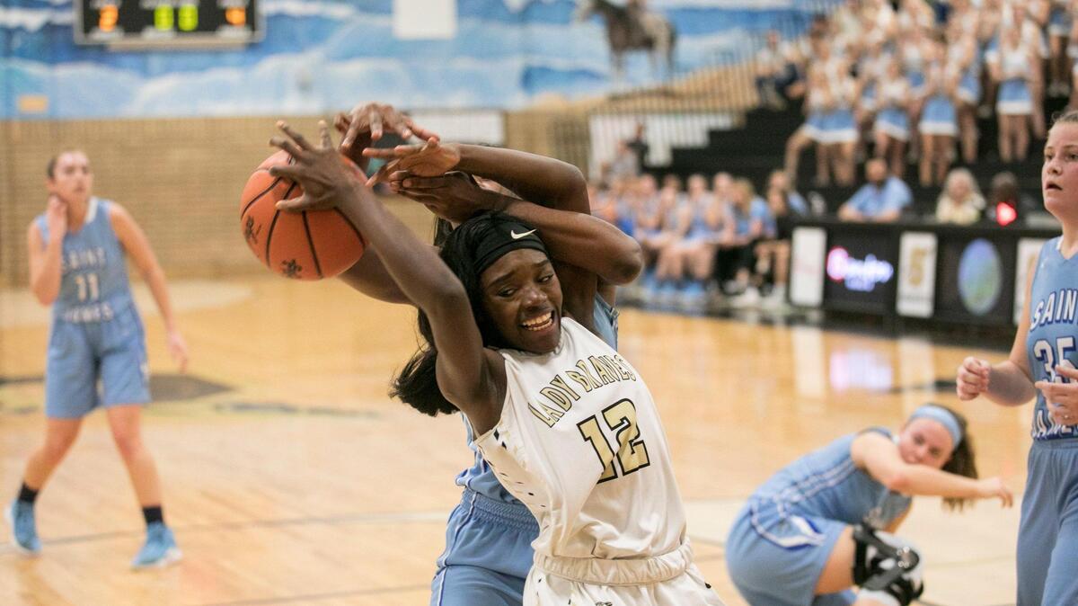 Socastee’s Mae Mae Arnold has the ball ripped from her hands by St. James’ Cherish Washington during the first round of the playoffs. The Socastee girls basketball team beat rival St. James in a hard fought first round of the class 5A playoffs at Socastee High School on Tuesdays night. . Feb 12, 2019.